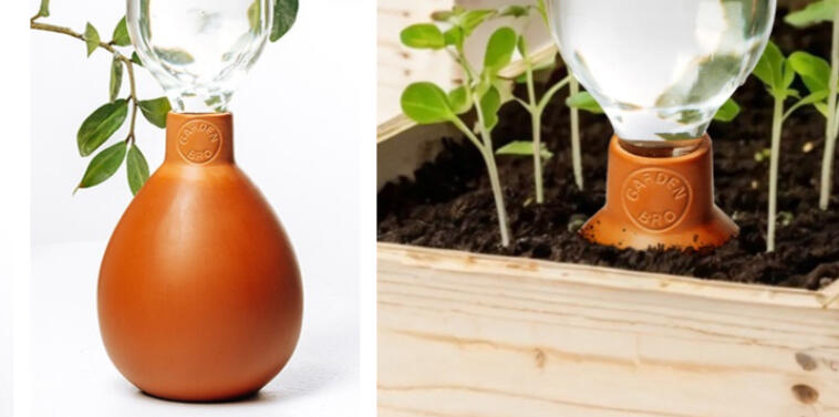 Two terracotta olla watering pots with glass reservoirs, one standalone and one placed in a seedling bed